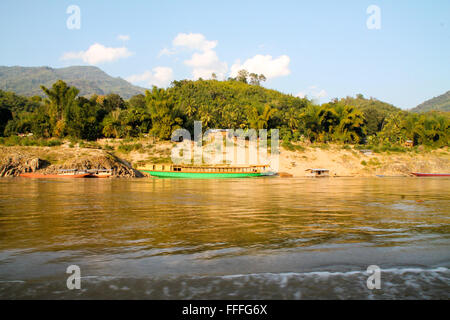 Small lonely rural riverside community in Laos Stock Photo