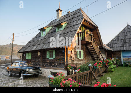 GAZ M21 Volga car (Third Series) in front of Main House of Drvengrad village (Kustendorf) built by Emir Kusturica, Serbia Stock Photo