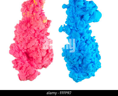 Multicolored ink drop swirling in water, creates an organic form of silky structure, with warm color tones. Stock Photo