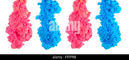 Multicolored ink drop swirling in water, creates an organic form of silky structure, with warm color tones. Stock Photo