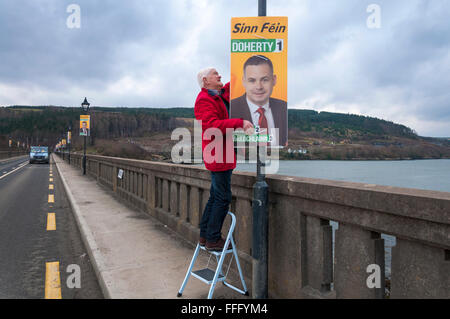 Gweebarra Bridge, County Donegal, Ireland. February 13th 2016. Election campaign poster of Pearse Doherty of Sinn Féin on the bridge in rural Donegal. He is a Teachta Dála - member of Irish Parliament - for the Donegal South–West constituency and is Sinn Féin's Dáil - parliamentary - spokesperson on Finance The Irish general election will take place on Friday, 26 February 2016. Photo by: Credit:  Richard Wayman/Alamy Live News Stock Photo