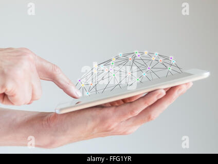 Mobile tablet in male hands with finger pointing at display. Concept of computer networks and social networks accessible Stock Photo