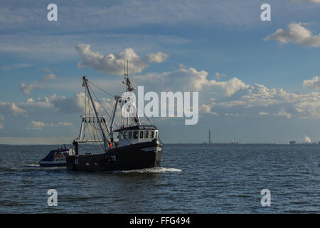 Fishing Boat Towing Smaller Craft in to Old Leigh Stock Photo