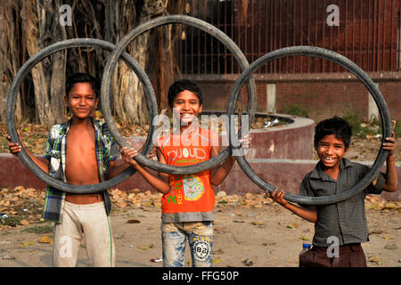 Dhaka, Bangladesh. 13th Feb, 2016. Bangladeshi slum children are posed with rejected tyres at Agargaon in Dhaka, Bangladesh. On February 13, 2016 Credit:  Mamunur Rashid/Alamy Live News Stock Photo