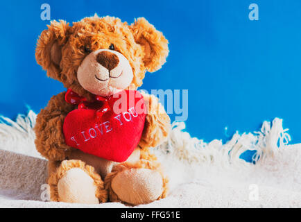 Teddy bear and big red heart with text "I Love You" Stock Photo