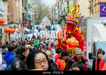 13th February 2016 Madrid, Spain. A long view of a red dragon at the end of the parade. The Chinese community in Madrid celebrated the Chinese New Year of the Monkey in the Usera district of Madrid, Spain. Credit:  Lawrence JC Baron/Alamy Live News. Stock Photo