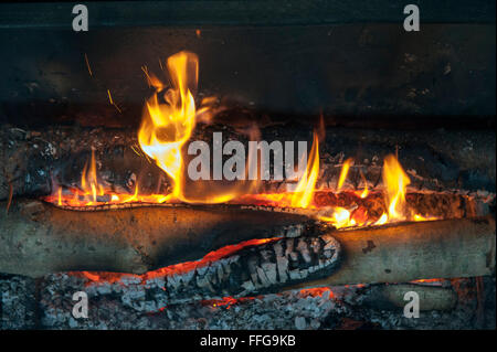 Wooden fire in old open oven England UK Europe Stock Photo