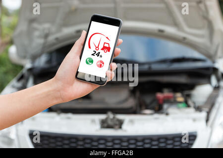 hand holding phone call emergency car service application Stock Photo