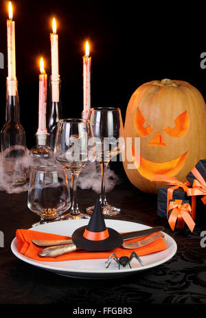 Witch's Hat as a decor element Halloween table setting Stock Photo