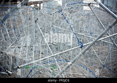 Metal fishing nets in a port. Horizontal shot Stock Photo