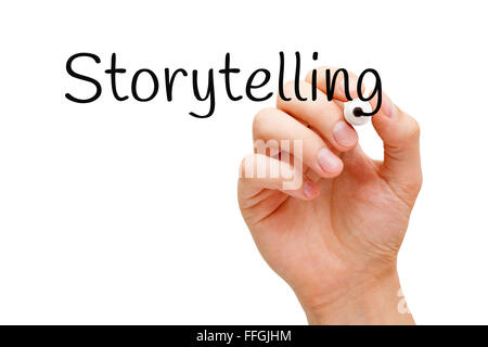 Hand writing Storytelling with black marker on transparent wipe board. Stock Photo