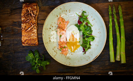 Poached eggs with salmon and rasparagus Stock Photo