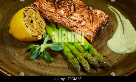 Poached eggs with salmon and rasparagus Stock Photo