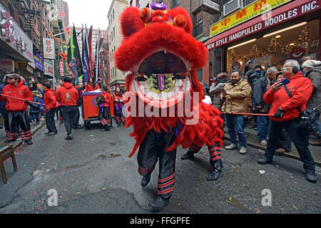 A lion dance outside a restaurant on Doyers Street in Chinatown in New York City on Lunar New Year 2016. Stock Photo