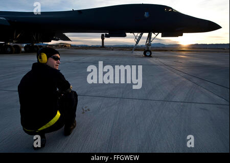 U.S. Air Force Airman 1st Class Neal Larson, 28th Aircraft Maintenance Squadron crew chief at Ellsworth Air Force Base, S.D., oversees a pre-flight check of a B-1B Lancer during Red Flag 12-2 at Nellis Air Force Base, Nev. Stock Photo