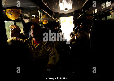 Vandenberg Air Force Base Hot Shot fire fighters wait in their truck for the call to action, tasked to cut a fire line on June 28, 2012 in the Mount Saint Francois area of Colorado Springs, Co. The team is helping to battle several fires in Waldo Canyon.  The Waldo Canyon fire has grown to 18,500 acres and burned over 300 homes. Currently, more than 90 firefighters from the Academy, along with assets from Air Force Space Command; F.E. Warren Air Force Base, Wyo.; Fort Carson, Colo.; and the local community continue to fight the Waldo Canyon fire. Stock Photo