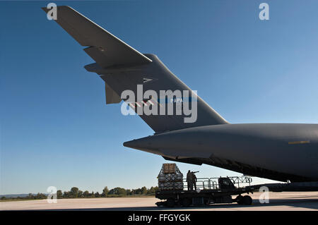 Aerial porters remove pallets from a C-17 Globemaster III after a recent Swedish mission. The HAW operates a fleet of three Globemaster IIIs  under the Strategic Airlift Capability program. The 10 NATO nations that participate in the program are Bulgaria, Estonia, Hungary, Lithuania, the Netherlands, Norway, Poland, Romania, Slovenia, the U.S. and two Partnership for Peace nations, Sweden and Finland. Stock Photo