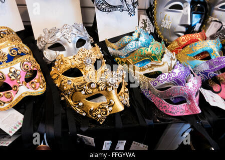 A large selection of Venetian face masks on sale on Portoblleo Road market, London, United Kingdom. Stock Photo