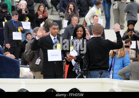 Air Force Staff Sgt. Serpico D. Elliot and Army Spc. Delandra Rollins stand-in as President Barack Obama and First Lady Michelle Obama during a dress rehearsal on the west front of the Capitol in preparation for the 57th Presidential Inauguration. Stock Photo