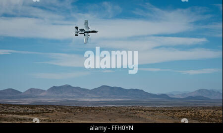 An A-10 Thunderbolt II with the 107th Fighter Squadron, assigned from Selfridge Air National Guard Base, Mich., simulates providing cover for ground personnel during an exercise at the Playas Training and Research Center in Playas, N.M.  The A-10 was the first Air Force aircraft designed solely for close air support. Stock Photo