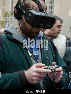 Man playing a virtual reality game wearing a headset - USA Stock Photo