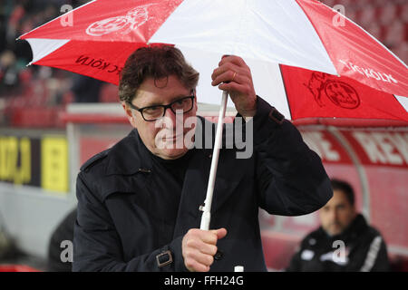 Cologne, Germany. 13th Feb, 2016. FC Koeln vs Eintracht Frankfurt: Vice president Harald Toni Schumacher (Koeln) with umbrella.  Credit:  Juergen Schwarz/Alamy Live News Stock Photo