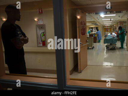 Wendell Thibeaux, husband of Staff Sgt. Chantel Thibeaux, Dental technical school, Joint Base-Fort Sam Houston, Texas, dental assistant instructor, waits for his wife as doctors bring her out after surgery. The two have been nearly inseparable since discovering the disease. Wendell has supported Chantel every step of the way. Doctors informed Wendell that the surgery went very well. Stock Photo