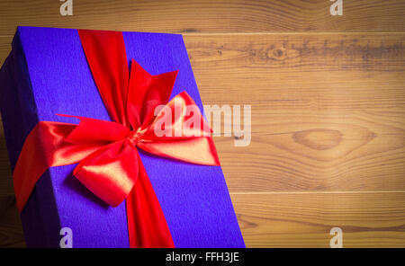 Gift box on wooden background Stock Photo