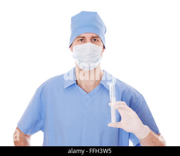 Full isolated studio picture from a young male doctor with syringe in his hand. Stock Photo