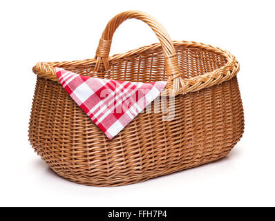Wicker picnic basket with red checked napkin, isolated on the white background. Stock Photo