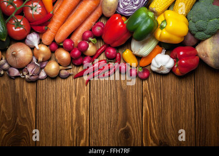 Fresh vegetables on the wooden surface. Stock Photo