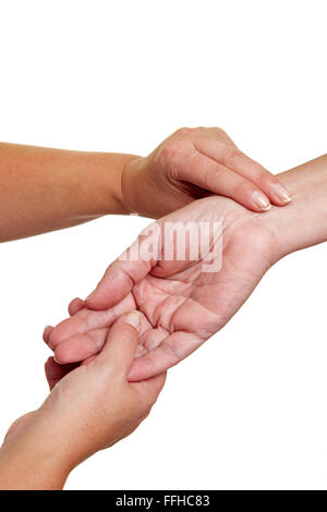 Hands measuring blood preasure with fingers at wrist Stock Photo