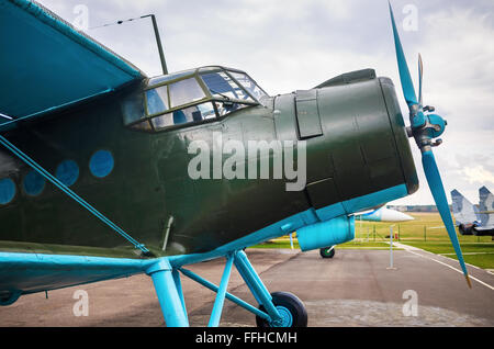 Close-up of vintage biplane. Fuselage of the old single-engine aircraft with propeller. Retro airplane. Stock Photo