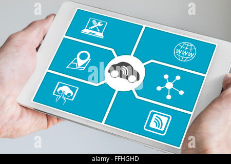 Connected car and digital mobility concept. Hand holding modern tablet. Stock Photo
