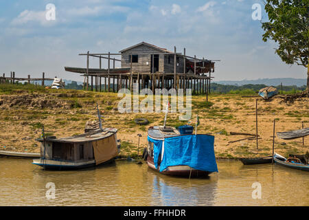 River Boat and House On Stilts Santarem Brazil Stock Photo