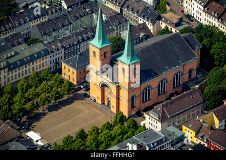 Aerial view, Basilica of St. Lawrence in Elberfeld is the main Catholic church Wuppertal built in neoclassical style in pink Stock Photo