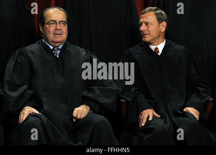 Washington, District of Columbia, USA. 8th Oct, 2010. Chief Justice John G. Roberts (R) chats with Associate Justice Antonin Scalia as the Supreme Court Justices of the United States sit for a formal group photo in the East Conference Room of the Supreme Court in Washington on Friday, October 8, 2010. Credit: Roger L. Wollenberg - Pool via CNP © Roger L. Wollenberg/CNP/ZUMA Wire/Alamy Live News Stock Photo