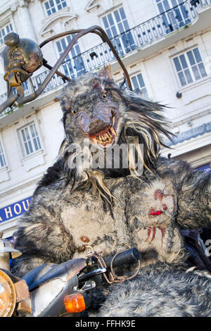 Lougarock by Compagnie du Theatre du Vertige at Blackpool, Lancashire, UK. 14th February 2016.  Terror on the streets of Blackpool as a unique werewolf from France towers three metres tall, frightening those who have lost their innocence. Credit:  Cernan Elias/Alamy Live News Stock Photo