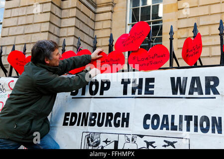 Edinburgh, Scotland, UK. 14th Feb, 2016. The 'Stop Trident' campaign held rallies across Scotland including Edinburgh and Glasgow, to highlight the number of people who died as a result of the nuclear bombing of Hiroshima and Nagasaki during WW2 and to make people aware of the bigger demonstartion in London on 27 February. To represent the bomb victims, 140,000 origami red cranes will be distributes as a symbol of remembrance and peace. Credit:  Findlay/Alamy Live News Stock Photo
