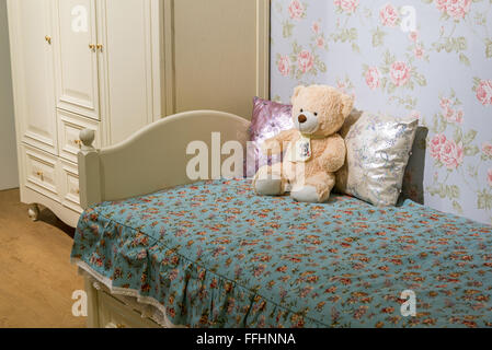 Detail of bedrooms for girls with a teddy bear Stock Photo