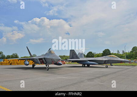Singapore. 14th Feb 2016. Aerial display at Singapore Airshow 2016. Two US Air Force Lockheed Martin F-22 Raptor stealth fighter jets on static display for the first time at the Singapore Airshow. Credit:  Richard Koh/Alamy Live News Stock Photo