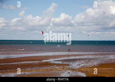 Kitesurfing or Kiteboarding at the beach At Hunstanton on a blustery day North Norfolk Coast Norfolk England Stock Photo