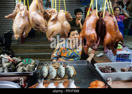 Market stall and street food being prepared in Chinatown Bangkok, Thailand. Yaowarat, Bangkok’s Chinatown, is the World’s most r Stock Photo