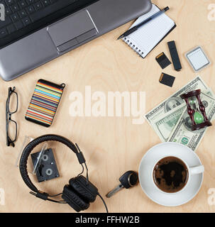 Flat lay of personal stuff, notebook computer,cards, coffee, money and other. Flat design and top view on desk as frame with bla Stock Photo