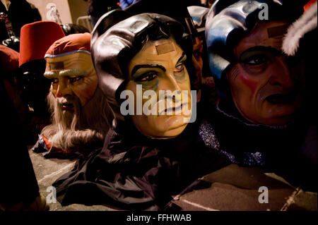 Traditional capgrossos (or cardboard  big heads) are seen in Barcelona, Spain, during the Santa Eulalia winter Festival. Stock Photo