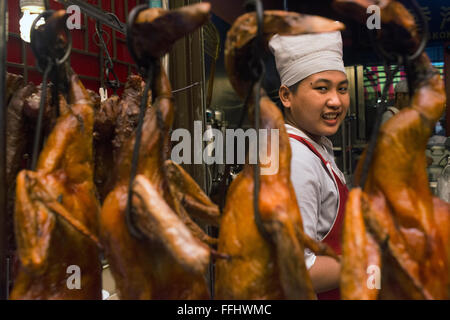 Cooker and Roasted dusk in a restuarnt. Bangkok Chinatown market, thailand. Thanon Yaowarat road at night in central Chinatown d Stock Photo