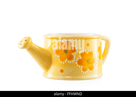 close up of small ceramic watering can over white Stock Photo