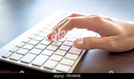 Female hands typing on keyboard. Stock Photo