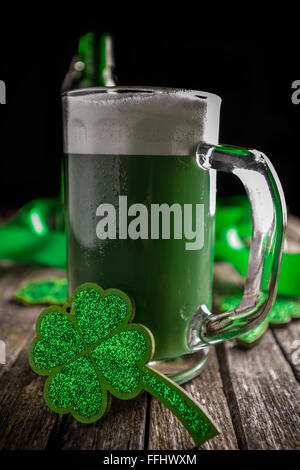 St. Patrick's day holiday celebration, lucky clover and green beer Stock Photo