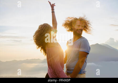 Happy couple in the sun on a background of mountains. stock image. Stock Photo